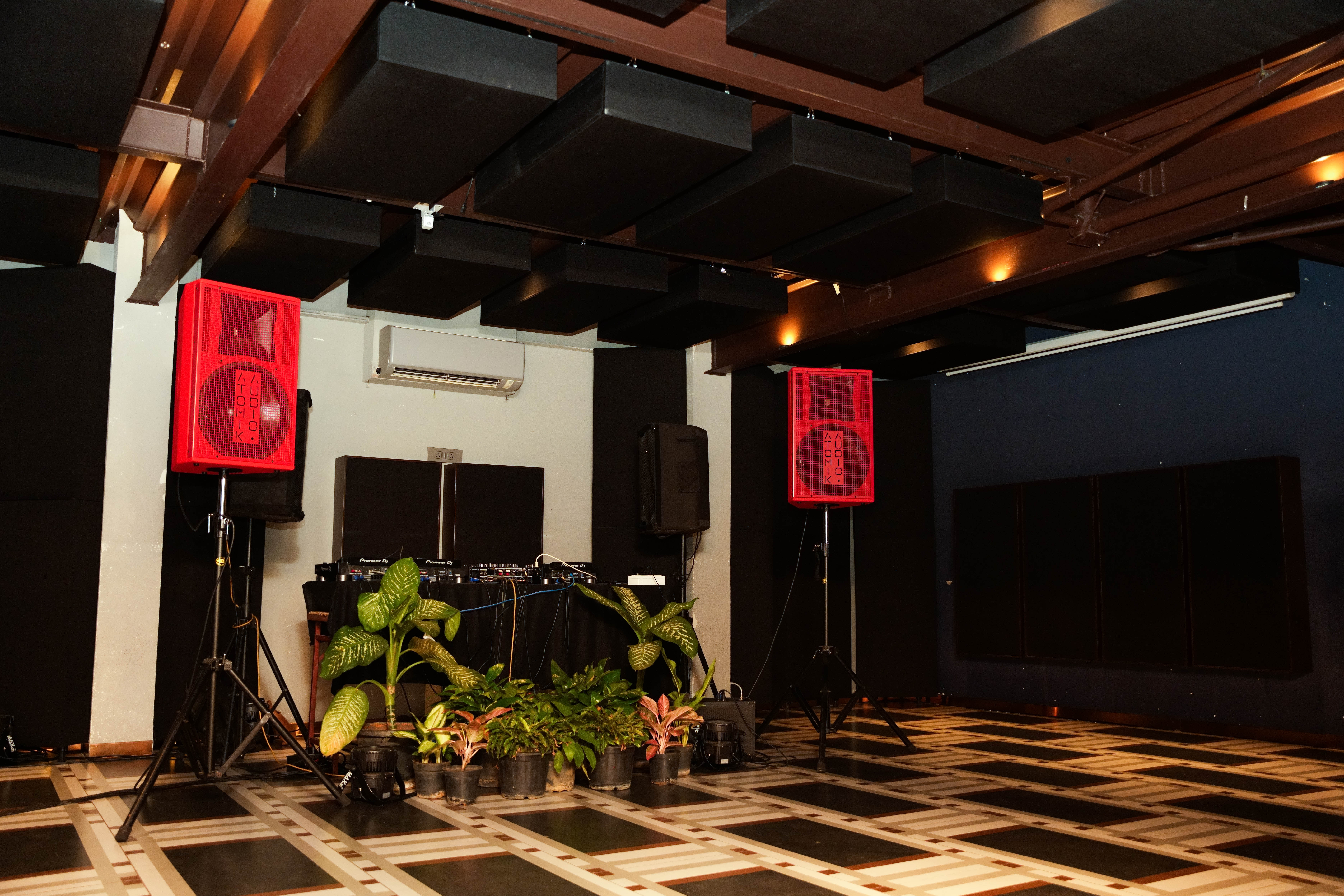 The Burrow, Bengaluru — ceiling cloud array and wall-mounted TRU Sink panels after acoustic treatment